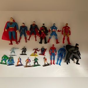9 superhero figures and 10 superhero metal cake toppers